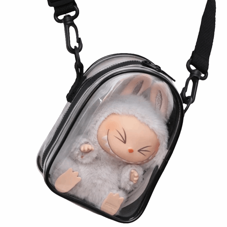 alt="Mini sac à bandoulière transparent pour figurine Labubu – design elliptique élégant, PVC imperméable avec nylon, protection contre eau et poussière"