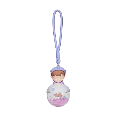 Labubu porte-clés en forme de balle avec un personnage mignon dans un petit aquarium.