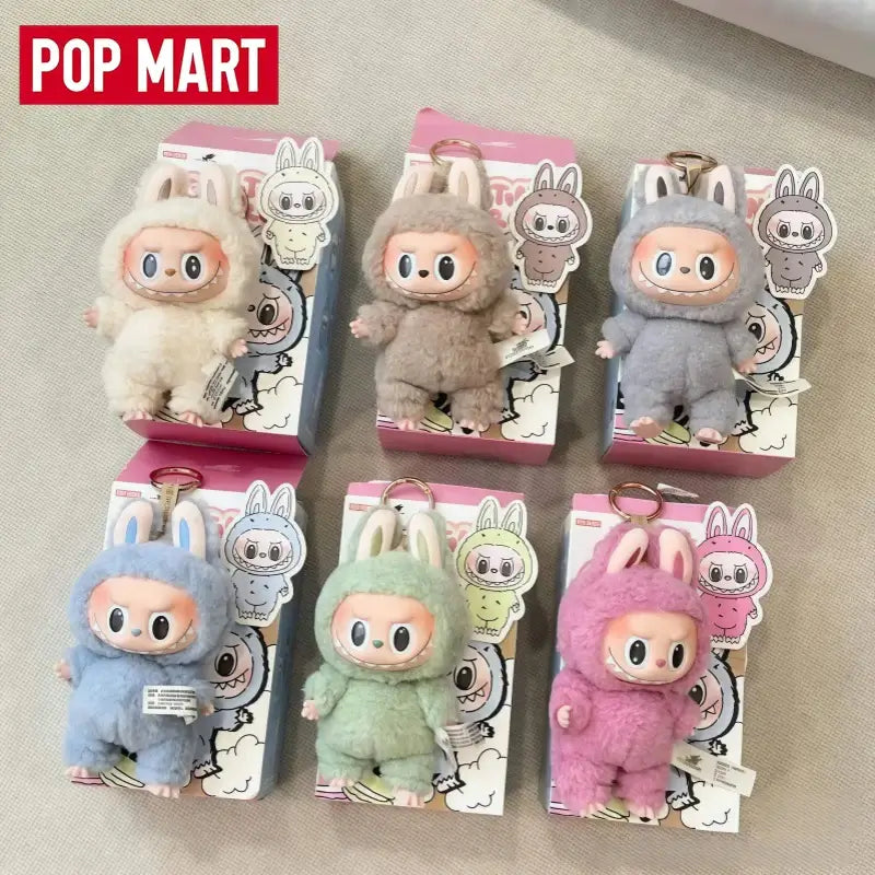 Labubu figurines in pastel colors from Pop Mart, featuring adorable bunny designs and soft textures.
