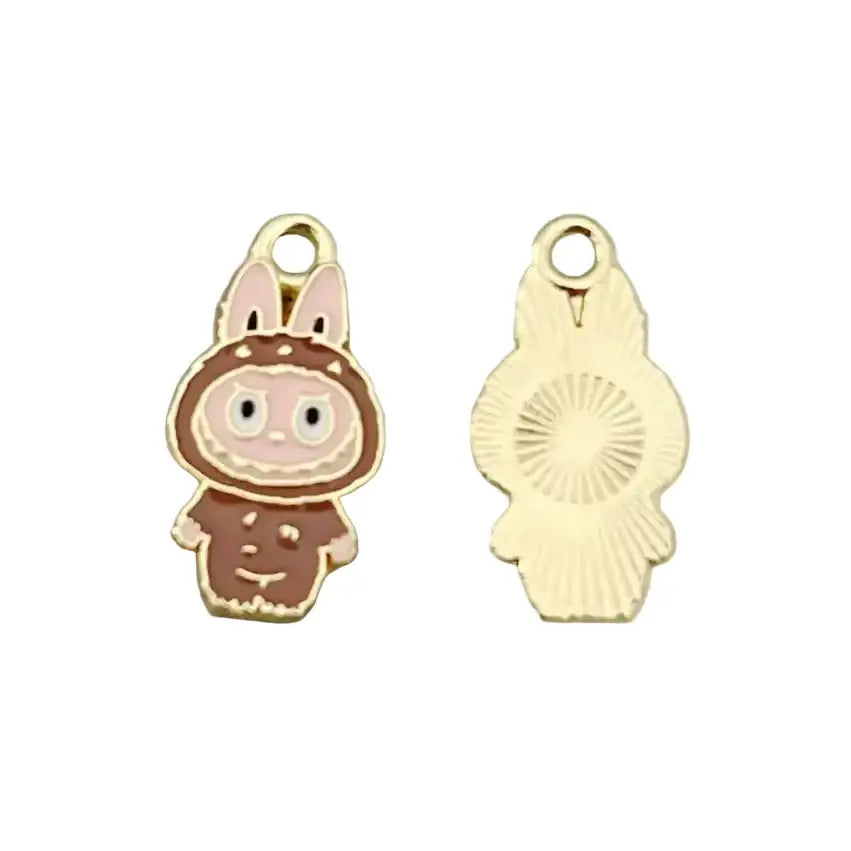Pendentifs Labubu - Charm en forme de personnage mignon avec des oreilles de lapin et un fond doré.
