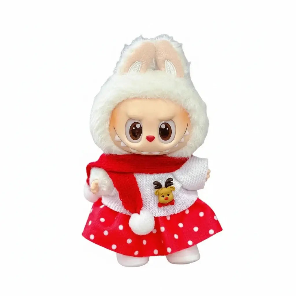 Doll dressed in festive Christmas outfit with red skirt, white scarf, and reindeer design, representing Labubu Tenues Noël Esprit Couture.